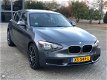 BMW 1-serie - 116i Sport Aut8 PDC/Keyless Go/Stoelv - 1 - Thumbnail