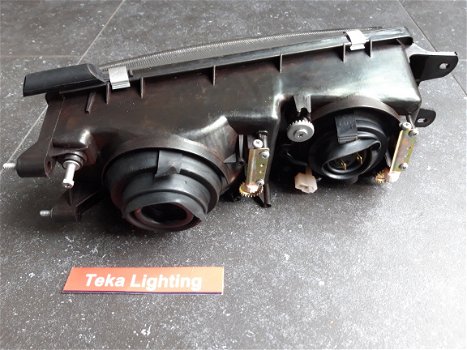 Mitsubishi Lancer IV (88-92) Koplamp Depo 214-1112 Links NOS - 6