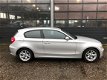 BMW 1-serie - 118i Business Line NIEUWSTAAT 133.000 km - 1 - Thumbnail