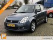 Suzuki Swift - 1.3 Shogun 5 DEURS/AIRCO/BLUETOOTH/CRUISE/LM. VELGEN rijklaarprijs - 1 - Thumbnail