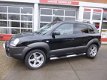 Hyundai Tucson - 2.0I CVVT STYLEVERSION Premium 2WD AIRCO/CRUISE/LEER/LEER - 1 - Thumbnail