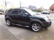 Hyundai Tucson - 2.0I CVVT STYLEVERSION Premium 2WD AIRCO/CRUISE/LEER/LEER - 1 - Thumbnail