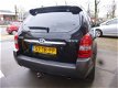 Hyundai Tucson - 2.0I CVVT STYLEVERSION Premium 2WD AIRCO/CRUISE/LEER/LEER - 1 - Thumbnail