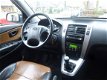 Hyundai Tucson - 2.0I CVVT STYLEVERSION Premium 2WD AIRCO/CRUISE/LEER/LEER - 1 - Thumbnail