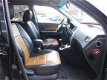 Hyundai Tucson - 2.0I CVVT STYLEVERSION Premium 2WD AIRCO/CRUISE/LEER/LEER - 1 - Thumbnail