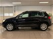 Volkswagen Tiguan - 1.4 TSI Sport&Style * 1e Eig / Navigatie / Trekhaak (af fabriek) - 1 - Thumbnail