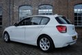 BMW 1-serie - 114i EDE Upgrade Edition 2013, Navigatie, Bluetooth, PDC, Leder, Cruise control, LMV e - 1 - Thumbnail