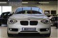 BMW 1-serie - 118i 5DRS Automaat Upgrade Edition / NAVIGATIE / SCHUIFDAK / STOELVERWARMING / LED VER - 1 - Thumbnail