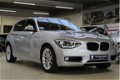 BMW 1-serie - 118i 5DRS Automaat Upgrade Edition / NAVIGATIE / SCHUIFDAK / STOELVERWARMING / LED VER - 1 - Thumbnail