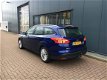 Ford Focus Wagon - 1.0 Ecob.125pk Titanium NAVI/CLIMA/PDC/17INCH/TREKHAAK - 1 - Thumbnail