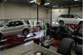 Dacia Duster - 1.6 Aniversare 2WD, Airco, CV, Leder, LMV, org. NL - 1 - Thumbnail