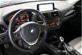 BMW 1-serie - 114i High Executive Urban Line / Leder / Navigatie Professional / Xenon / Stoelverwarm - 1 - Thumbnail