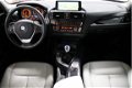 BMW 1-serie - 114i High Executive Urban Line / Leder / Navigatie Professional / Xenon / Stoelverwarm - 1 - Thumbnail