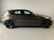 BMW 1-serie - 118i High Executive Leer PDC 19' Climate+Cruise control - 1 - Thumbnail