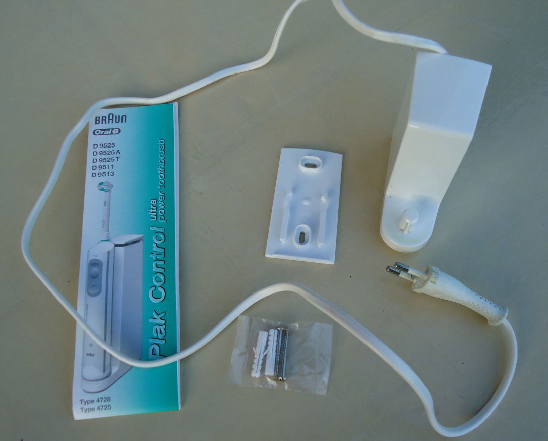 Een oplader voor een elektrische tandenborstel van Oral-B. - nr. 1