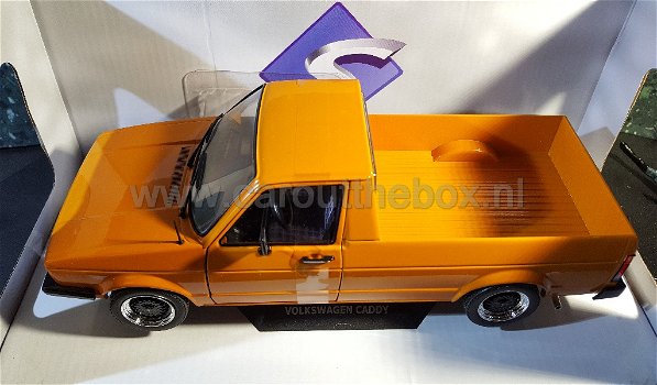 Volkswagen Caddy pick-up oranje 1:18 Solido - 1