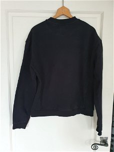 Primark zwarte sweater met witte tekst maat S