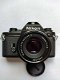 Nikon EM met originele lens, boekje en motor drive in super nieuw staat zonder krasjes - 0 - Thumbnail