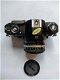 Nikon EM met originele lens, boekje en motor drive in super nieuw staat zonder krasjes - 1 - Thumbnail