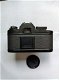 Nikon EM met originele lens, boekje en motor drive in super nieuw staat zonder krasjes - 2 - Thumbnail