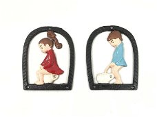 Set toilet tekens van een jongen en een meisje, in kleur