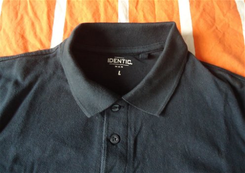 Te koop een nieuwe donkerblauwe polo van Identic (maat: L). - 1