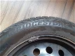 Mooie Bridgestone winterbandenset op stalen velg (15 inch) + wieldoppen + bandenstandaard - 2 - Thumbnail