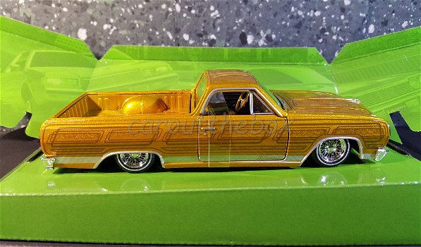 Chevrolet El Camino Lowrider 1986 goud 1:24 Maisto MA236 - 0