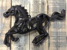 wanddecoratie van een rennend paard