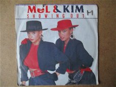  a5500 mel and kim - showing out