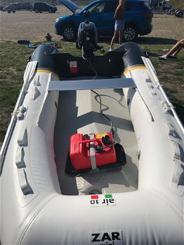 Rubberboot compleet met buitenboordmotor. - 1