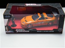 Toyota Supra MK IV Fast and Furious modelauto + figuur Brian 1:24
