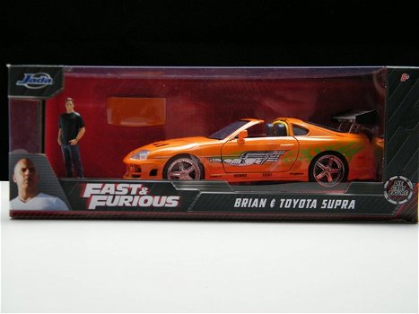 Toyota Supra MK IV Fast and Furious modelauto + figuur Brian 1:24 - 1