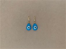 Gouden hoop oorbellen met blauwe evil eye bedel hippie ibiza