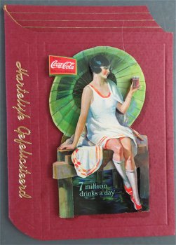 FELICITATIE --- Coca Cola dame op een boek - 0