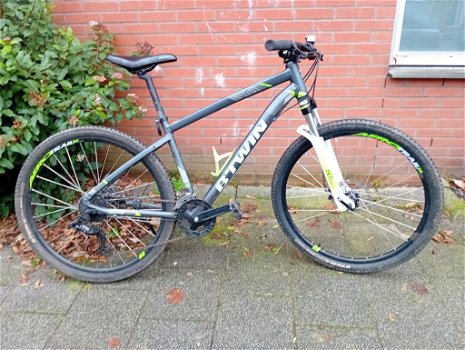 B-twin Rockrider Mountainbike 21versn. 27.5ïnch wielen en schijfremmen te koop i.v.m.aankoop E-Bike - 0