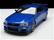 Nieuw miniatuur modelauto Nissan Skyline GT-R R34 – Welly 1:24 - 1 - Thumbnail