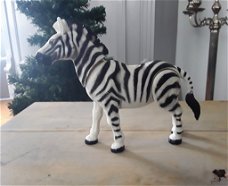 Zebra / zebrapaard met bewegende kop en poot