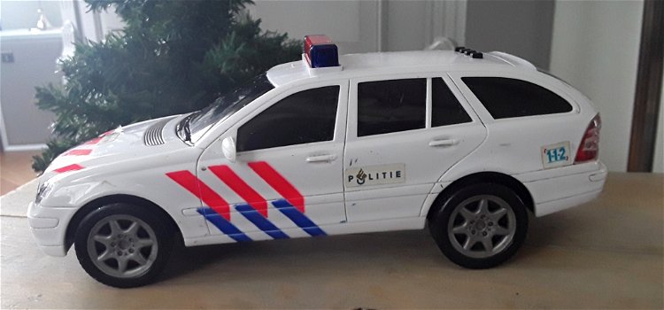 Politieauto met licht en geluid (1 zwaailichtlampje defect) - 0