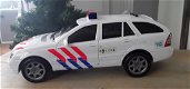 Politieauto met licht en geluid (1 zwaailichtlampje defect) - 0 - Thumbnail