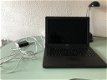 Zwarte Macbook W8727625YA4 en Apple Time Capsule met 2 Terrabyte opslag en een Stroomadapter Enz. - 5 - Thumbnail