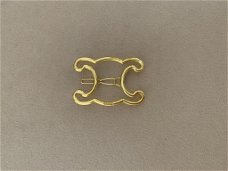 Gouden letter logo triomphe haar speld clip