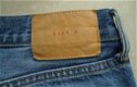 Te koop gedragen blauwe spijkerbroek van H&M (maat: 36). - 7 - Thumbnail