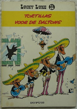 Strip Boek, Lucky Luke, Tortillas Voor De Daltons, Nummer 31, Dupuis, 1977. - 0