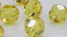 Swarovski 5000 Light Topaz 6mm 28 Stuk of Per St.