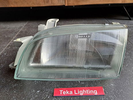 Toyota Carina E T19 Koplamp Magneti Marelli LPC122 712754058931 Links - 1