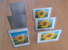 Te koop zes metalen fotolijstjes van Xenos (10 x 15 cm).