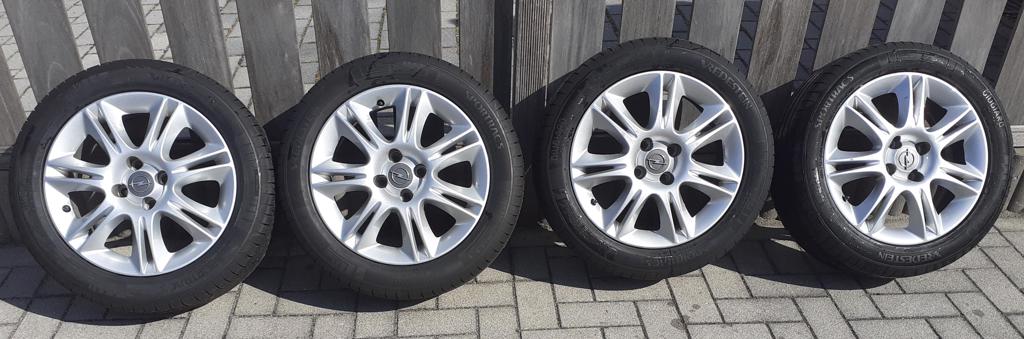 Originele lichtmetalen wielen met zomerbanden Opel Corsa 2011 - 0