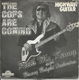 Ruth McKenny – The Cops Are Coming (1979) Belgium - 0 - Thumbnail