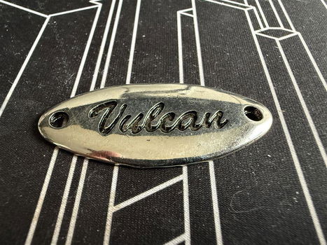 Ovaal metalen plaatje Vulcan, iets bijzonders - 0